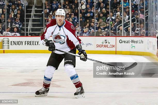 Patrick Wiercioch of the Colorado Avalanche keeps an eye on the play during first period action against the Winnipeg Jets at the MTS Centre on...