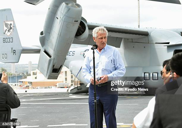 United States - U.S. Defense Secretary Chuck Hagel holds a media briefing aboard the amphibious transport dock ship Anchorage in Pearl Harbor,...