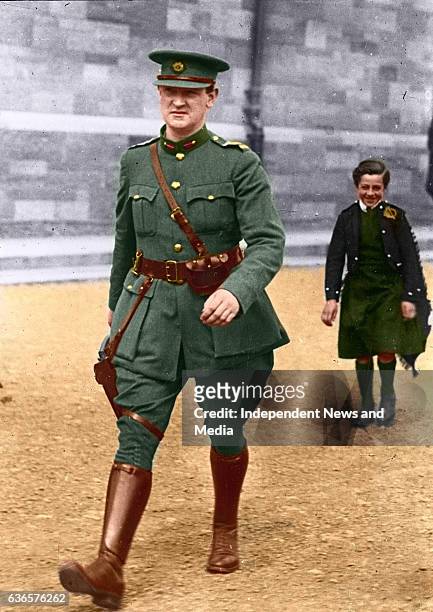 Michael Collins strides through Cathal Brugha Barracks, Dublin. A young civilian piper, Alphonsus Culloten, follows in tow. The shot was taken on...