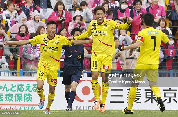 Japan - Junya Tanaka of Kashiwa Reysol celebrates with teammates after scoring the opening goal during the first half of a J-League game against...