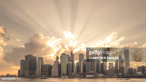 sunshine over new york - newly industrialized country stock pictures, royalty-free photos & images