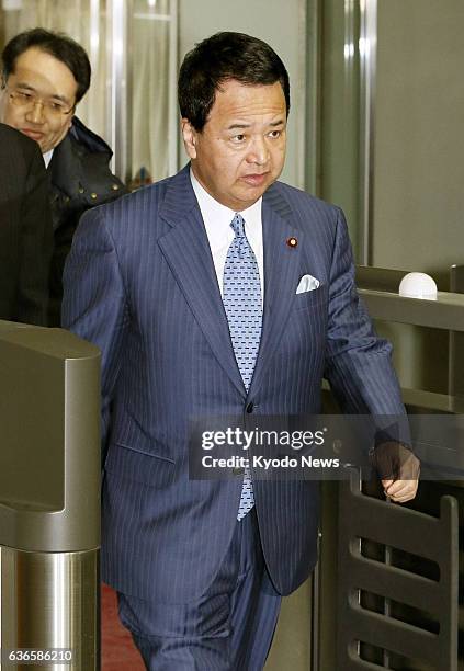 Japan - Akira Amari, Japan's minister in charge of the Trans-Pacific Partnership talks, arrives at the Cabinet Office building in Tokyo to hold talks...