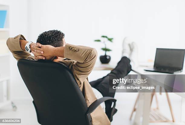 moment of relaxation - back of office chair stock pictures, royalty-free photos & images