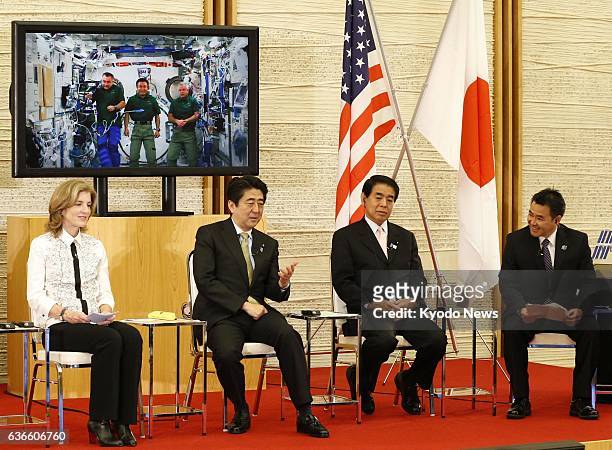 Japan - Japanese Prime Minister Shinzo Abe and others communicate with Japanese astronaut Koichi Wakata , captain of the International Space Station,...