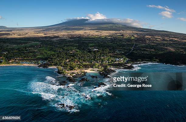Ocean front condominums and luxury homes are built at the ocean's edge on an old Mauna Loa lava flow as viewed on December 16 in this aerial photo...