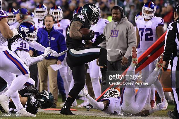 Zach Ertz , can't defend teammate Ryan Mathews , both of the Philadelphia Eagles, as he is forced out of bounds by Landon Collins as Kelvin Sheppard...