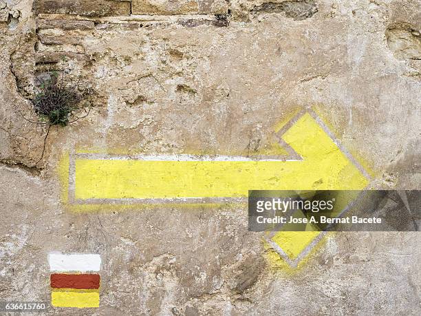 indications of colors painted on an ancient wall in the mountains, indication of colors and path arrow gr - graffiti arrow stock pictures, royalty-free photos & images