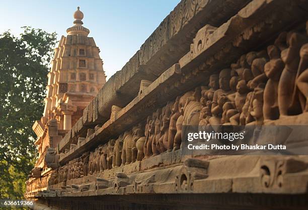 sculptures at the plinth of khajuraho temple - khajuraho statues stock pictures, royalty-free photos & images