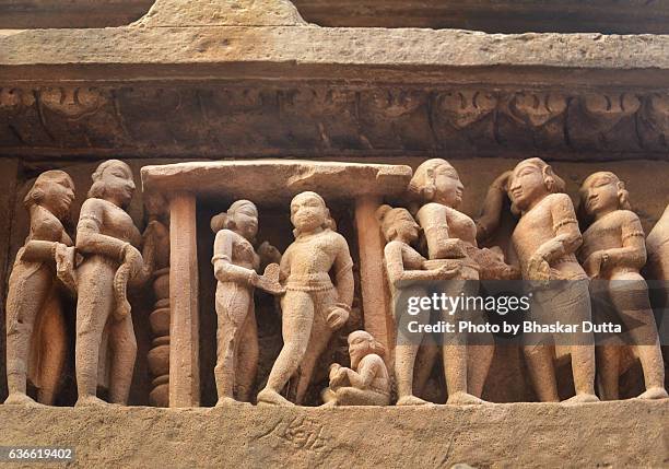 sculpture of wedding ceremony at khajuraho temple - khajuraho statues stock pictures, royalty-free photos & images