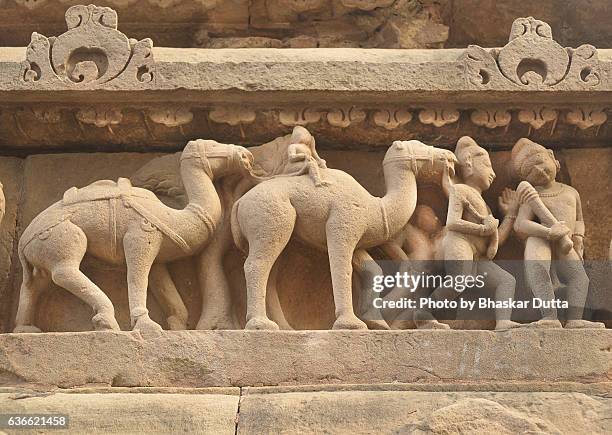 sculptures of soldiers with camels at khajuraho temple - khajuraho statues stock pictures, royalty-free photos & images