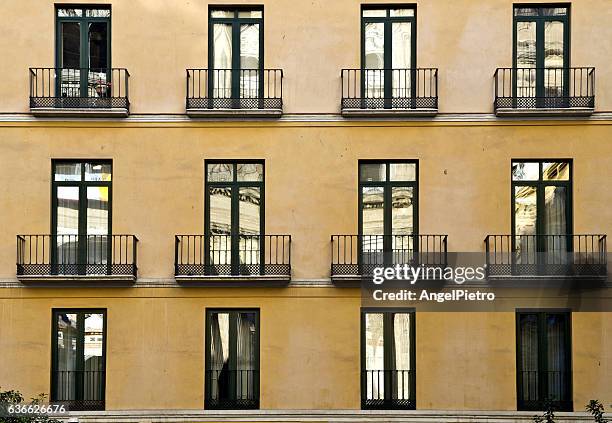 windows and balconies - apartment facade stock pictures, royalty-free photos & images