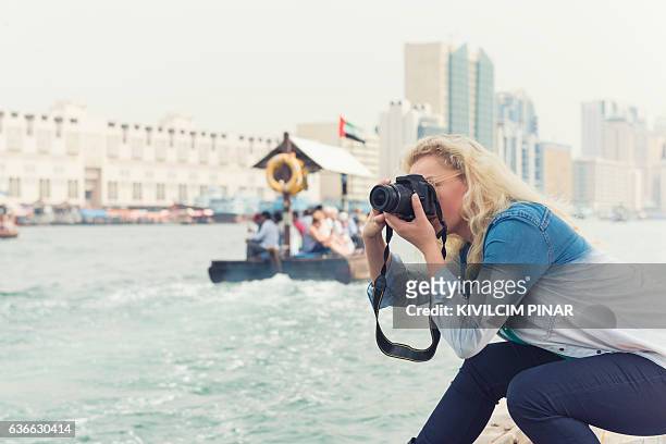 solo traveller woman in old dubai - dubai tourism stock pictures, royalty-free photos & images