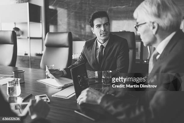businessmen working in the office - black and white office stock pictures, royalty-free photos & images