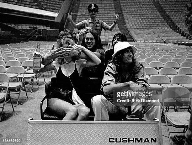 Fleetwood Mac, Rock and Roll Hall of Fame Mick Fleetwood carts around with friends at The Omni Coliseum in Atlanta Georgia June 1, 1977