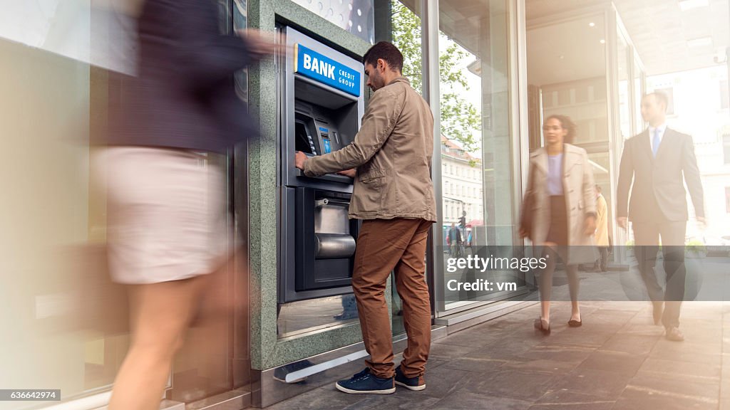 Man in front of an ATM machine