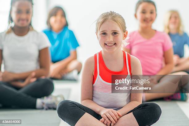 learning yoga at school - correct sitting posture stock pictures, royalty-free photos & images