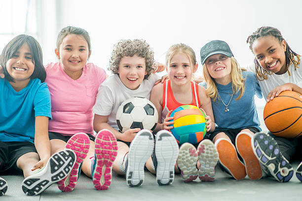 children playing various sports - girls volleyball stock pictures, royalty-free photos & images