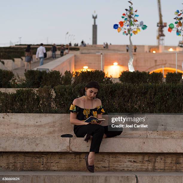 woman reading book at cascade steps in yerevan, armenia - the capital of the armenian city stock pictures, royalty-free photos & images
