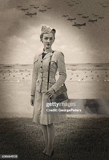 vintage world war 2 female navy officer on normandy beach - bomber plane stock pictures, royalty-free photos & images