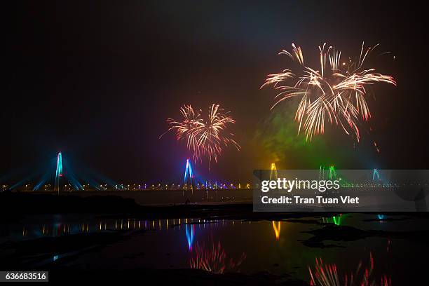 vietnam - firework landscape of nhat tan bridge by night - nhat tan bridge stock pictures, royalty-free photos & images