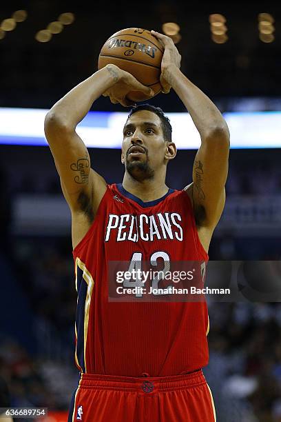 Alexis Ajinca of the New Orleans Pelicans shoots a foul shot during the first half of a game against the Miami Heat at the Smoothie King Center on...