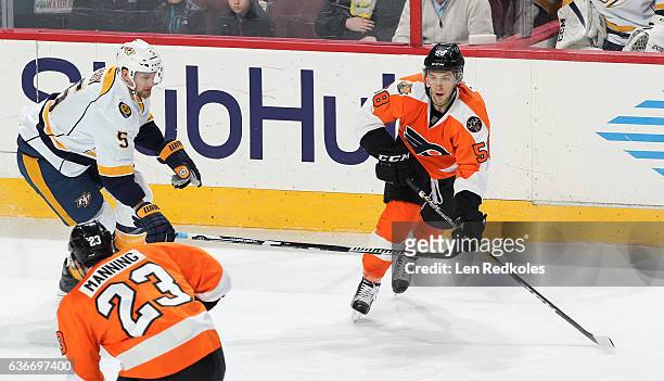 Taylor Leier of the Philadelphia Flyers skates against Adam Pardy of the Nashville Predators on December 19, 2016 at the Wells Fargo Center in...