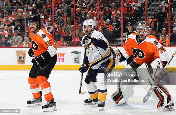 Michael Del Zotto and Steve Mason of the Philadelphia Flyers defend Mike Fisher of the Nashville Predators on December 19, 2016 at the Wells Fargo...