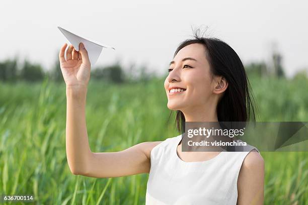 girl hands holding model airplane - beautiful chinese girl stock pictures, royalty-free photos & images