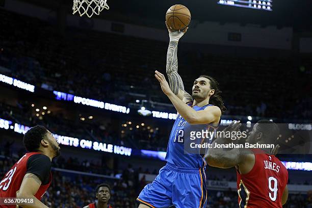Steven Adams of the Oklahoma City Thunder shoots over Anthony Davis of the New Orleans Pelicans and Terrence Jones during the second half of a game...