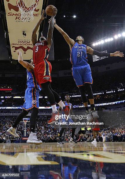 Terrence Jones of the New Orleans Pelicans drives to the basket against Andre Roberson of the Oklahoma City Thunder during the first half of a game...