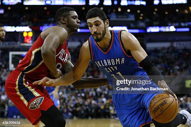 Enes Kanter of the Oklahoma City Thunder drives against Terrence Jones of the New Orleans Pelicans during the second half of a game at the Smoothie...