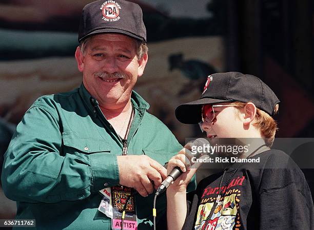 Columbia Co - Founder John Conlee and son John William Conlee perform as Hootie & the Blowfish host Farm Aid 1996 at William - Brice Stadium on the...