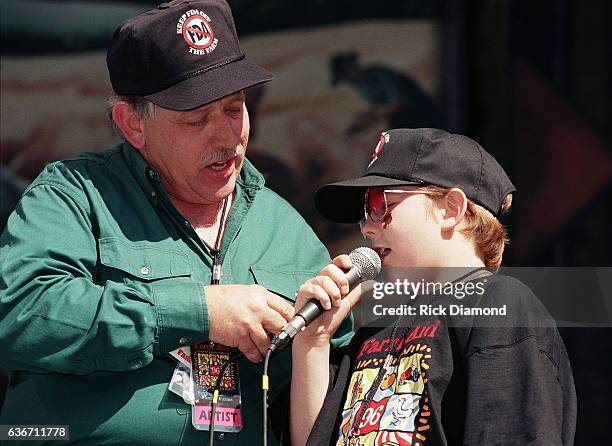 Columbia Co - Founder John Conlee and son John William Conlee perform as Hootie & the Blowfish host Farm Aid 1996 at William - Brice Stadium on the...