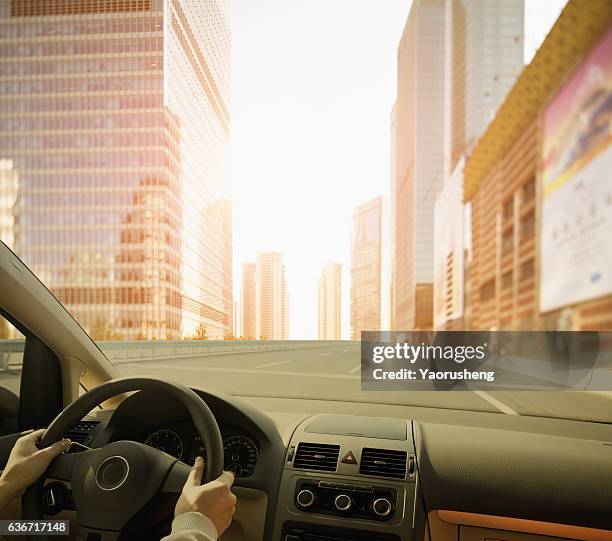 driving a car to a modem city,shanghai - auto cockpit bildbanksfoton och bilder