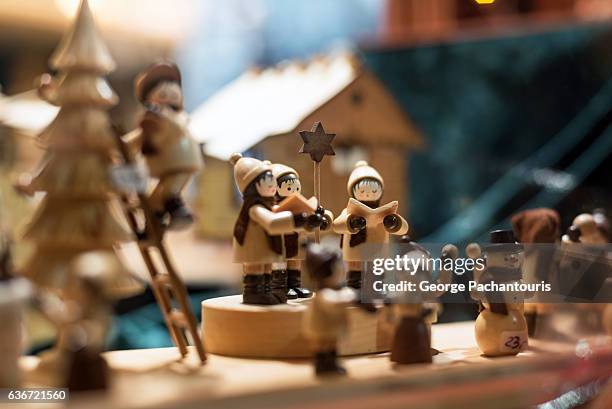 singing the christmas carols - carol singer stock pictures, royalty-free photos & images