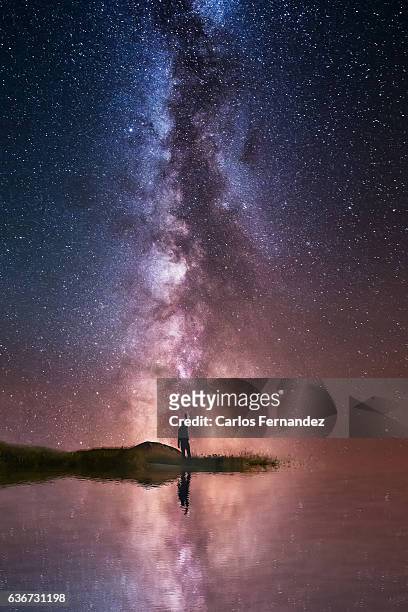 touching the milky way - man look sky stock pictures, royalty-free photos & images