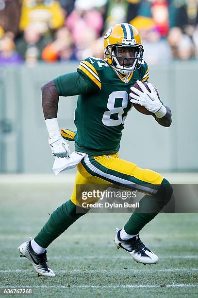 Geronimo Allison of the Green Bay Packers runs with the ball in the first quarter against the Minnesota Vikings at Lambeau Field on December 24, 2016...