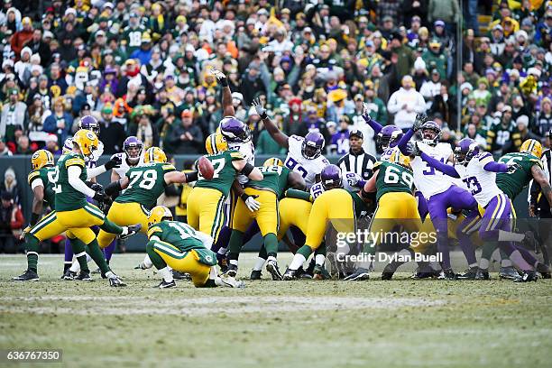 Mason Crosby of the Green Bay Packers kicks a field goal in the fourth quarter against the Minnesota Vikings at Lambeau Field on December 24, 2016 in...