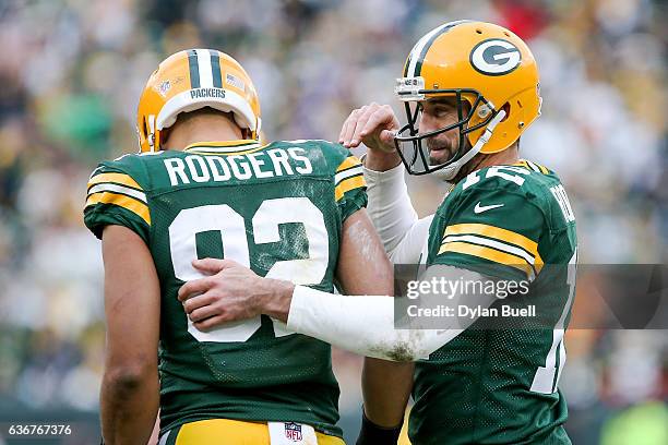 Aaron Rodgers and Richard Rodgers of the Green Bay Packers celebrate after scoring a touchdown in the fourth quarter against the Minnesota Vikings at...