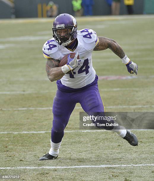 Matt Asiata of the Minnesota Vikings carries the ball during a game against the Green Bay Packers at Lambeau Field on December 24, 2016 in Green Bay,...