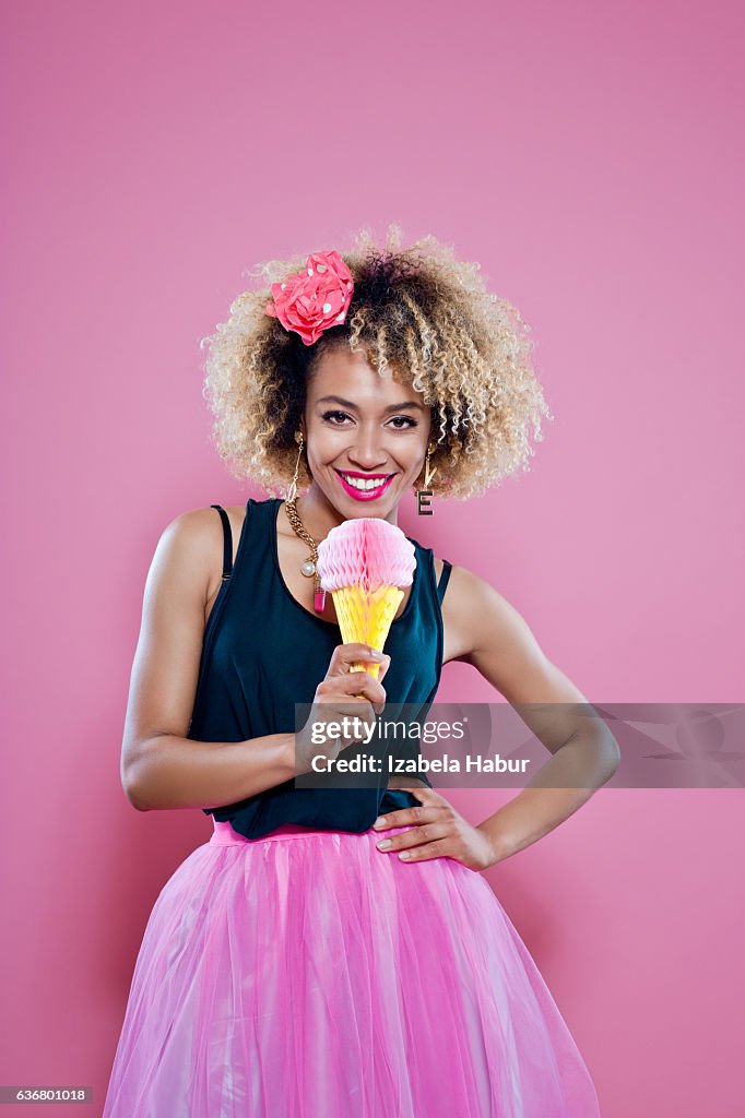 Cute young woman holding ice cream