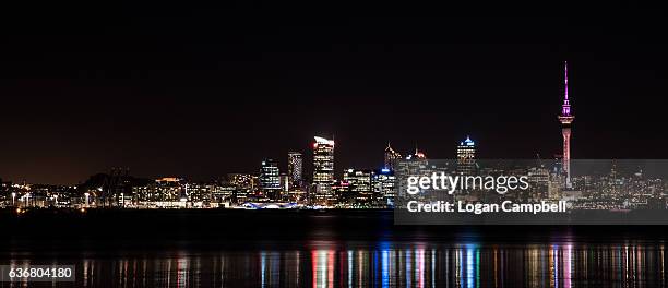 auckland skyline with sky tower night - auckland skyline stock pictures, royalty-free photos & images