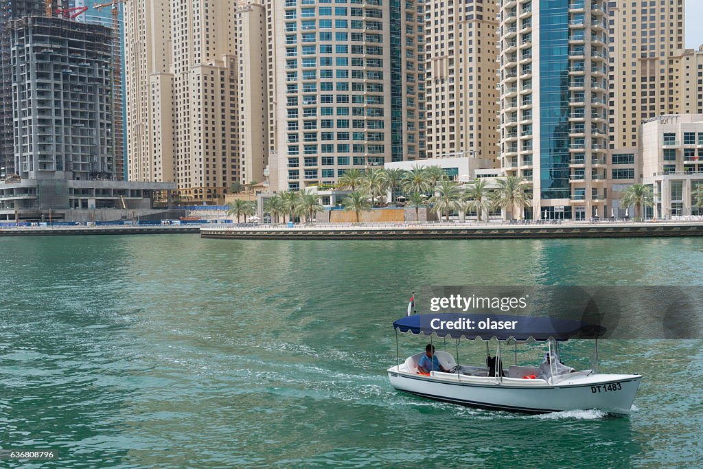 Dubai marina skyscrapers, boat close up