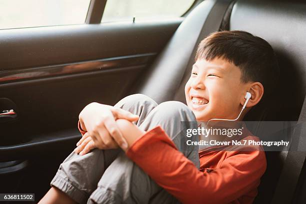 the boy listened to music with headphones. - motorheadphones stock pictures, royalty-free photos & images