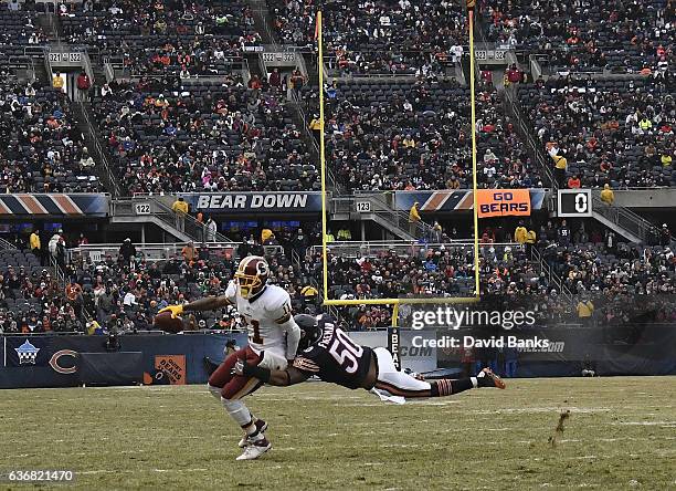 DeSean Jackson of the Washington Redskins is tackled by Jerrell Freeman of the Chicago Bears during the second quarter at Soldier Field on December...