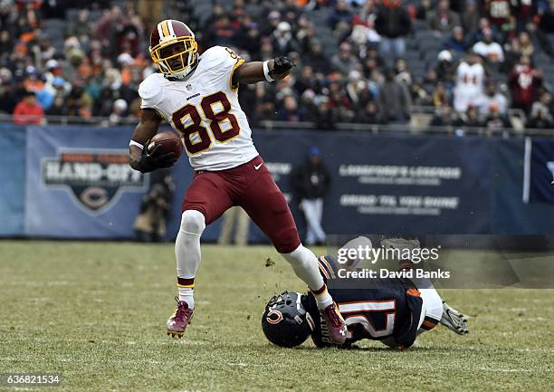 Pierre Garcon of the Washington Redskins catches a pass in front of Tracy Porter of the Chicago Bears during the second quarter at Soldier Field on...