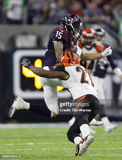 Darqueze Dennard of the Cincinnati Bengals tackles Will Fuller of the Houston Texans in the fourth quarter at NRG Stadium on December 24, 2016 in...