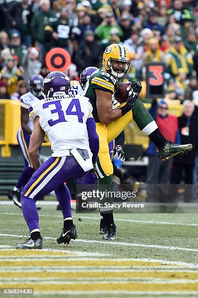 Richard Rodgers of the Green Bay Packers catches a pass for a touchdown during the second half of a game against the Minnesota Vikings at Lambeau...