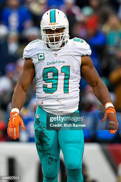 Cameron Wake of the Miami Dolphins reacts following his sack against the Buffalo Bills during the second quarter at New Era Field on December 24,...