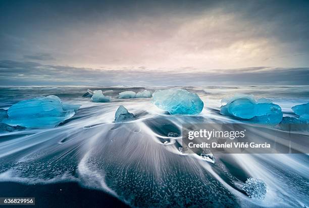 icebergs on the jokulsarlon glacial lake - iceland stock pictures, royalty-free photos & images